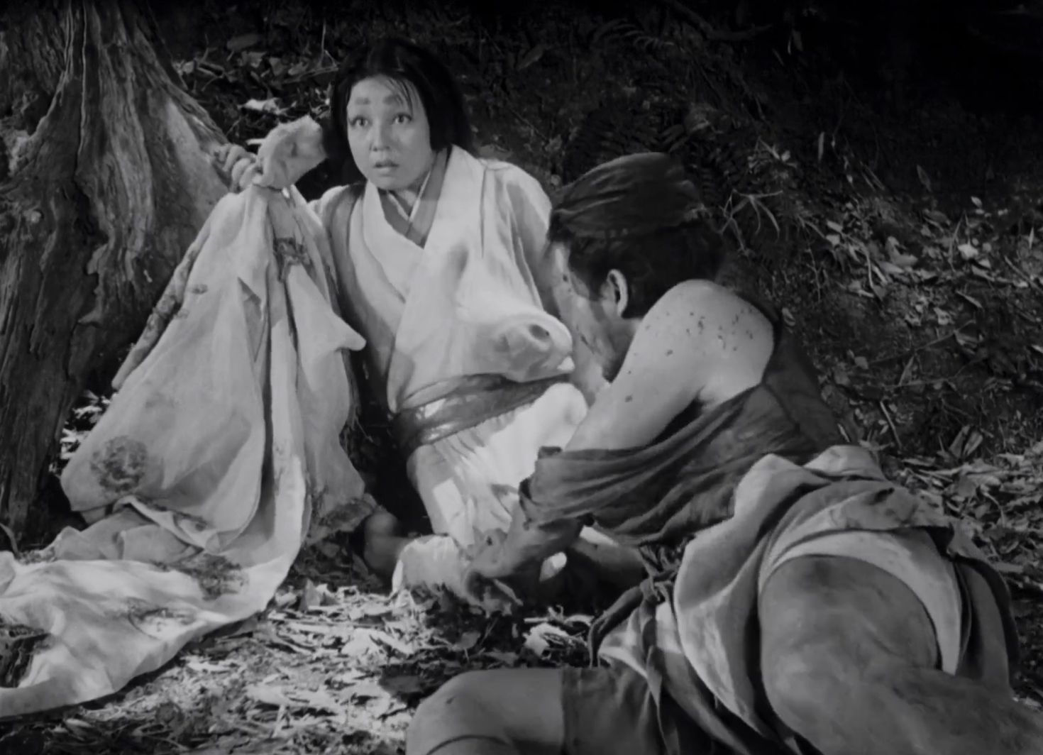 Bandit crouching toward woman